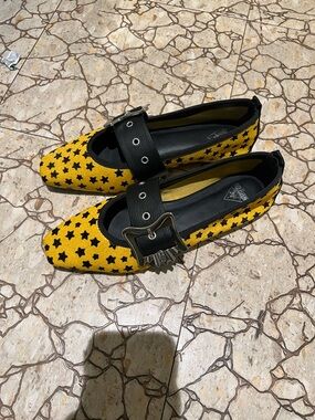 John Fluevog Yellow Star-Print Flats with Black Buckle Strap